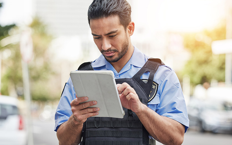 Man using tablet device in office.