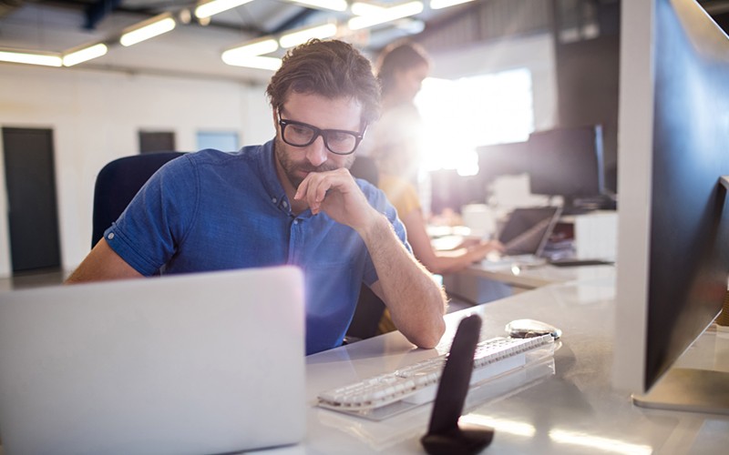 Businessman on desktop computer